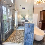 pebble stone shower with a glass enclosure in a luxury bathroom remodel in Bel Air Maryland