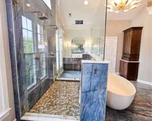 pebble stone shower with a glass enclosure in a luxury bathroom remodel in Bel Air Maryland