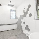 Beautiful tile shower with glass enclosure